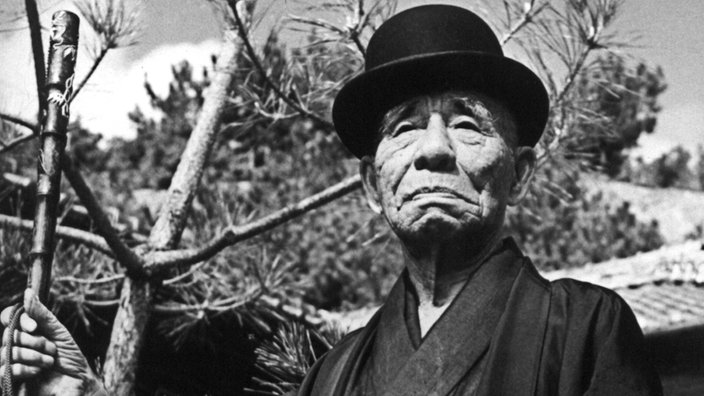 Schwarzweiß-Porträtfoto von Kokichi Mikimoto | Bildquelle: dpa Schwarzweiß-Porträtfoto von Kokichi Mikimoto