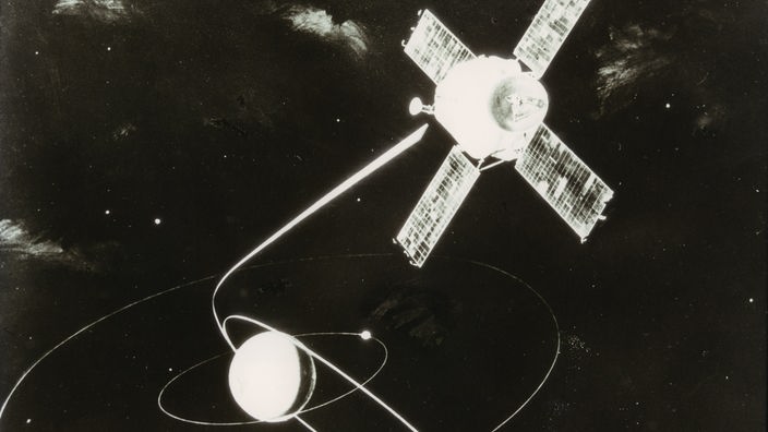 Das Bild zeigt schmematisch die Raumsonde Mariner 9 im Weltall. 