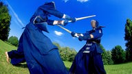 Ein Kendo-Kampf mit Holzschwertern