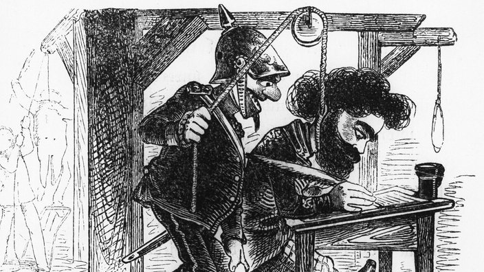 Karikatur: Ein Mann sitzt an einem Schreibtisch und verfasst einen Text, daneben ein preußischer Soldat und ein Galgen | Bildquelle: picture alliance / ullstein bild / Archiv Gerstenberg Karikatur: Ein Mann sitzt an einem Schreibtisch und verfasst einen Text, daneben ein preußischer Soldat und ein Galgen
