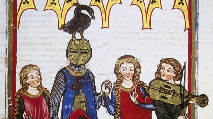 Ein Ritter in blauer Rüstung steht in der Mitte von drei Frauen.