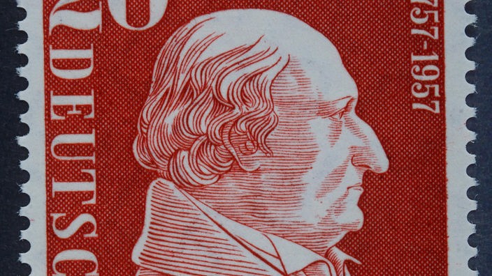 Eine rote 20-Pfennig-Briefmarke mit Freiherr vom Stein