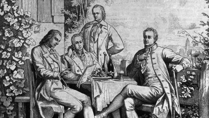 Schwarzweiß-Stich: Alexander von Humboldt  mit Goethe, Schiller und seinem Bruder Wilhelm