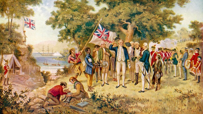 James Cook und seine Männer in der australischen Botany Bay. Ein Mann schwenkt die britische Fahne.