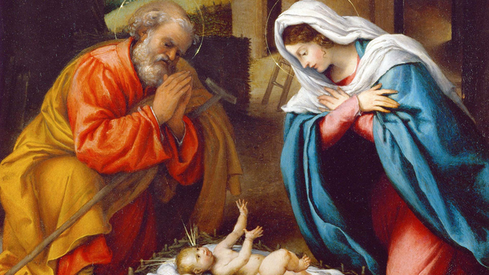 Gemälde: Josef und Maria beten an der Krippe, in der Jesus liegt.