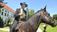 Westernreiter Fred Rai auf einem Pferd
