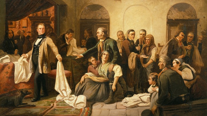 Gemälde von Carl Wilhelm Hübner - in der Mitte eine entsetzte Weberfamilie, links davon ihr Auftraggeber, der ihre gewebten Stoffe ungünstig beurteilt; um sie herum andere zum Teil ärmliche Gestalten.