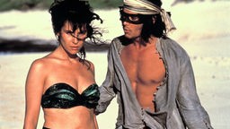 Johnny Depp mit schwarzer Augenmaske als verführerischer Don Juan DeMarco mit schöner junger Frau.