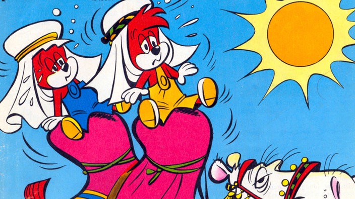 Das Cover eines Fix und Foxi-Comics zeigt die beiden Füchse, wie sie auf einem Kamel durch die Wüste reiten. | Bildquelle: picture alliance / dpa Das Cover eines Fix und Foxi-Comics zeigt die beiden Füchse, wie sie auf einem Kamel durch die Wüste reiten.