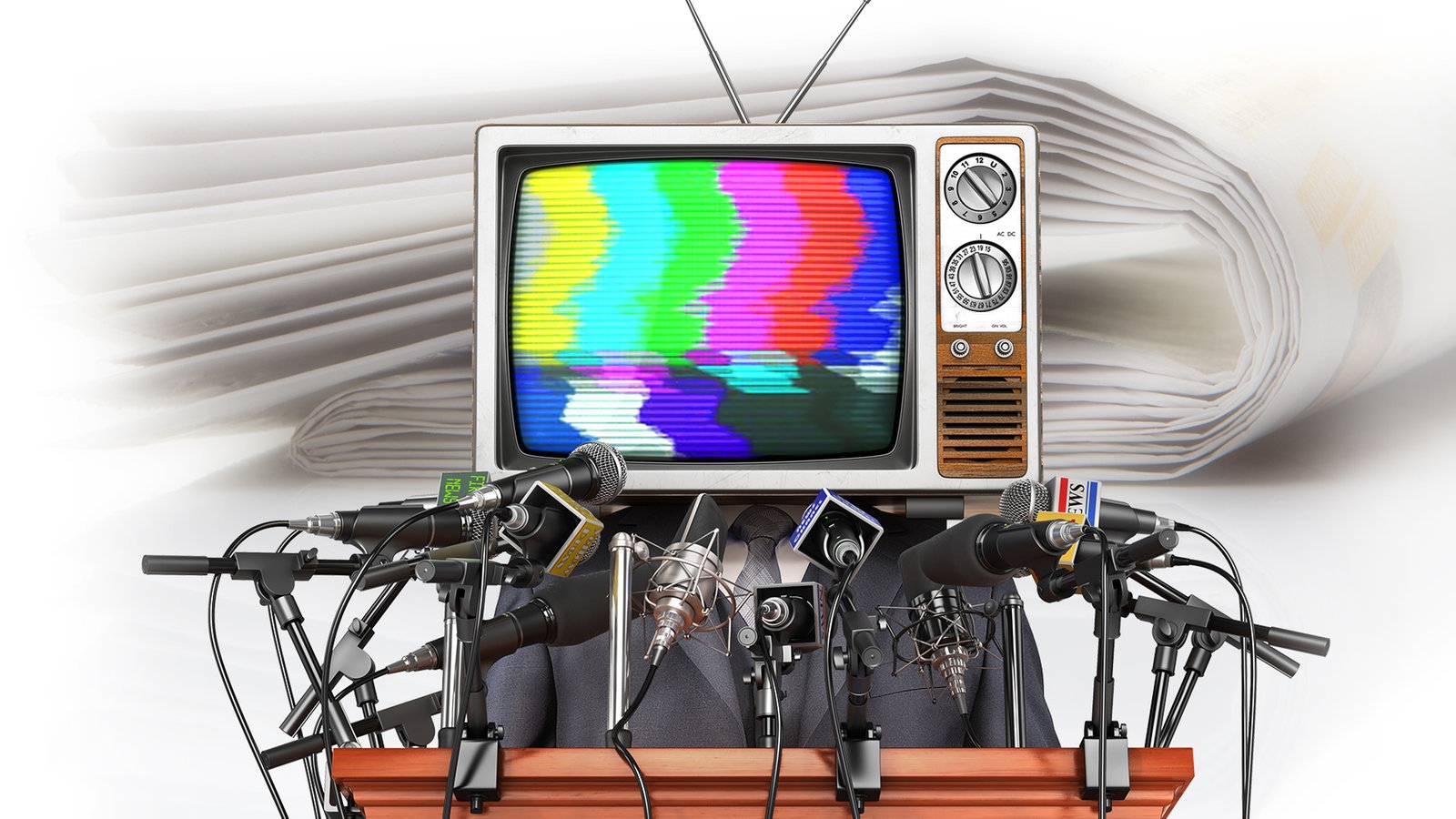 Ein Fernseher mit Mikrophonen davor.