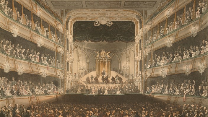Druckgrafik von 1808: Bühne mit Zuschauersaal und Logen an den Seiten im "Covent Garden Theatre"