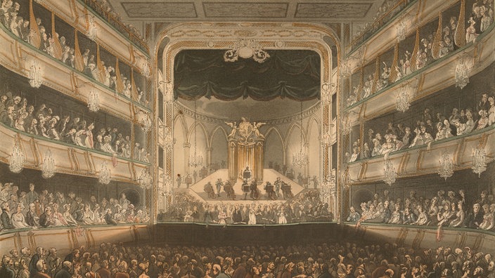 Druckgrafik von 1808: Bühne mit Zuschauersaal und Logen an den Seiten im "Covent Garden Theatre" | Bildquelle: akg-images Druckgrafik von 1808: Bühne mit Zuschauersaal und Logen an den Seiten im "Covent Garden Theatre"