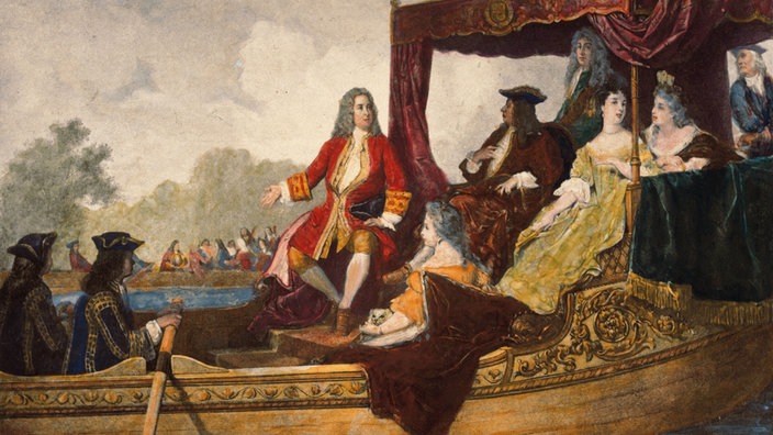 Ein Gemälde aus dem 19. Jahrhundert zeigt ein Schiff mit einem Baldachin, unter dem König Georg I. mit mehreren Personen sitzt. Händel ist in roter Kleidung im Zentrum des Bildes. Am Ufer im Hintergrund ist eine Menschenmenge angedeutet. | Bildquelle: akg-images Ein Gemälde aus dem 19. Jahrhundert zeigt ein Schiff mit einem Baldachin, unter dem König Georg I. mit mehreren Personen sitzt. Händel ist in roter Kleidung im Zentrum des Bildes. Am Ufer im Hintergrund ist eine Menschenmenge angedeutet.