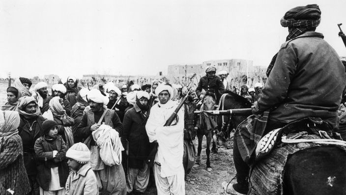 Moudjahedeen-Rebellen und Dorfbewohner 1980 während der sowjetischen Besatzungszeit