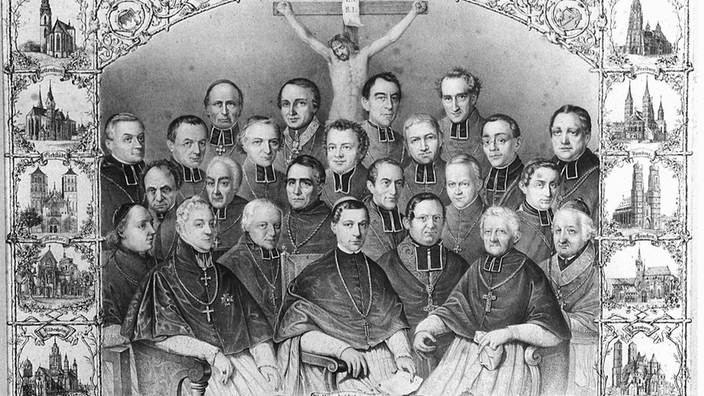 Ein Stich zeigt die versammelten Bischöfe 1848 in Würzburg, die um ein Kreuz mit Jesusfigur dargestellt sind.