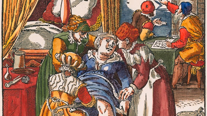 Holzschnitt aus einem Hebammenbuch von 1581: Eine Hebamme bei einer Gebärenden.