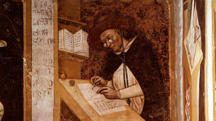 Gemälde: Ein Mönch mit Hut und Brille zeichnet an einem Pult.