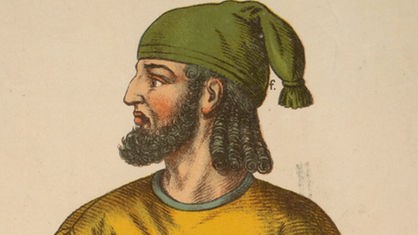 Grafik: Ein Mann mit Vollbart, Locken, grüner Mütze und orangefarbenem Umhang.