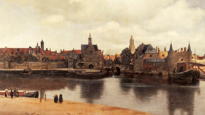 Das Gemälde zeigt eine Stadt an einem Fluss: Häuser, zum Teil mit Türmen, eine Kirche, Boote, die am Ufer liegen. | Bildquelle: akg-images / Erich Lessing Das Gemälde zeigt eine Stadt an einem Fluss: Häuser, zum Teil mit Türmen, eine Kirche, Boote, die am Ufer liegen.