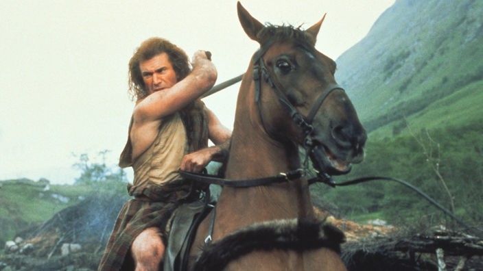 Mel Gibson als schottischer Nationalheld William Wallace auf einem Pferd