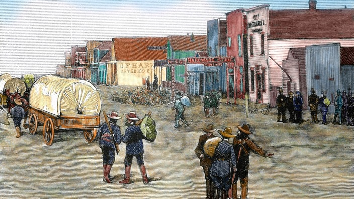Die Zeichnung "Main Street after the land rush, 1889" zeigt die Hauptstraße eines kleinen Dorfes in Oklahoma 1889 | Bildquelle: Prisma Archivo Fotográfico, S.L. Die Zeichnung "Main Street after the land rush, 1889" zeigt die Hauptstraße eines kleinen Dorfes in Oklahoma 1889