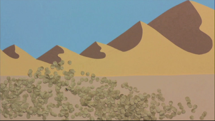 Grafik: Sanddünen im Hintergrund, im Vordergrund sieht man feine braune 'Sandkörnchen'.