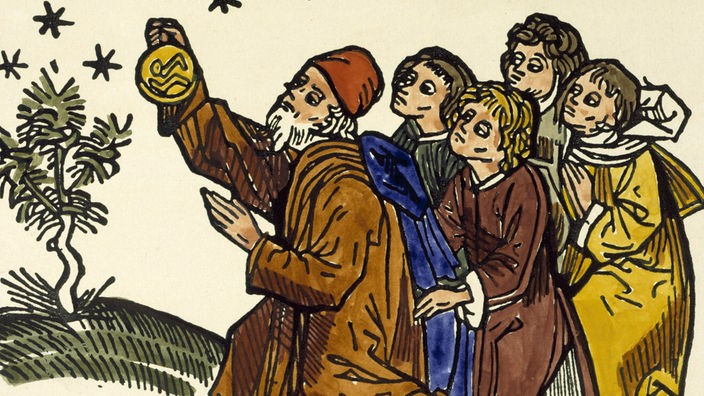 Der Holzschnitt zeigt den Philosophen Aristoteles mit einigen seiner Schüler.