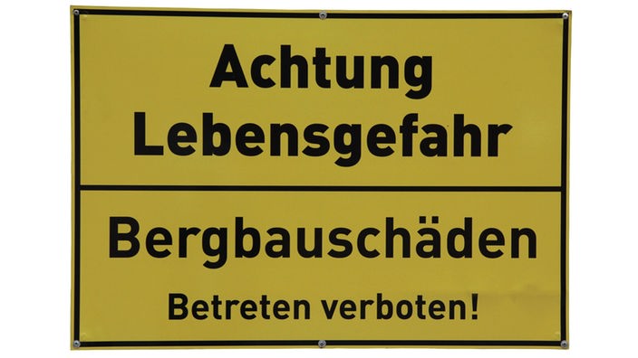 Schild warnt vor Bergbauschäden 