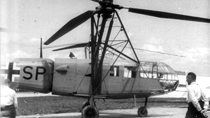 Hubschrauber 'Drache' mit zwei Auslegern mit Rotoren und geschlossener Kanzel