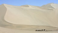 Karamelkarawane in einer chinesischen Wüste